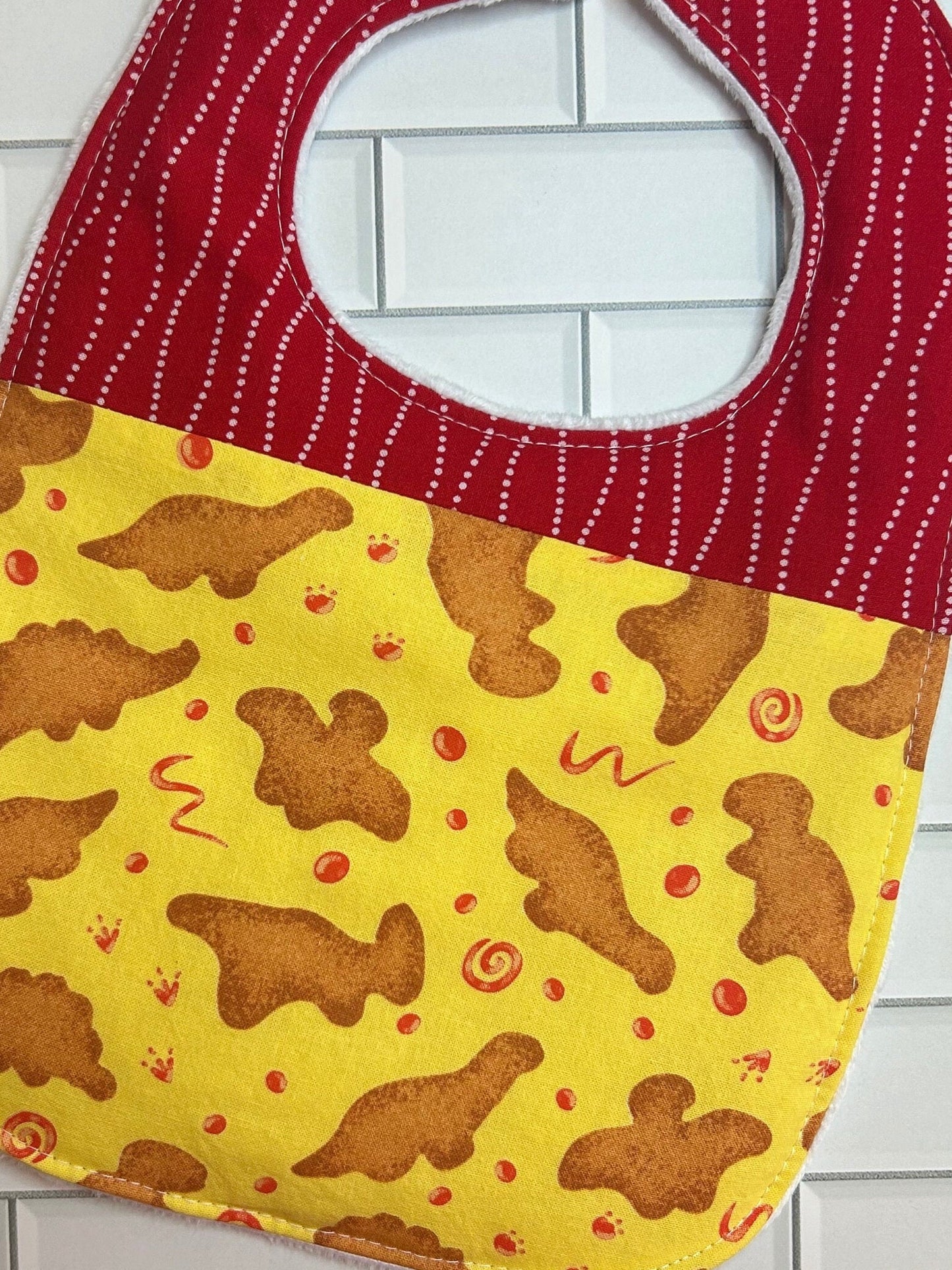 Dinosaur Nuggets Bib (fits up to 24 months)